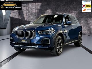 BMW X5 XDrive40i High Executive | H&K | Luchtvering | 21 inch | Multicontour stoelen | HUD | Luchtvering