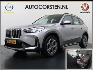 BMW X1 xDrive25e PHEV Hybrid 245pk Automaat Trekhaak Leder Sportstoelen 4WD Adap.Cruise Camera Navi Dual-Ecc ParkAssist Pdc Apple Carplay Android Lmv Elek.Achterklep Connect Drive Isofix DAB Led Regen-Lichtsensor Lane Assist Wifi AWD 1.700KG Trekgewicht 1e Eigen