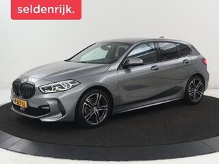 BMW 1-SERIE 118i M Sport | Carplay | Sportstoelen | Camera | Half leder | Navigatie | Live Cockpit | Park Assist | Full LED | Climate control | Sfeerverlichting | Cruise control | Bluetooth